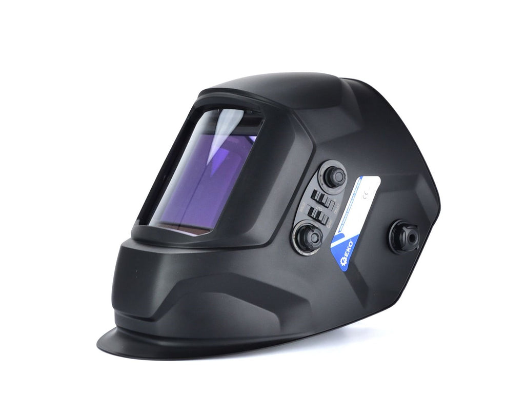 Auto-darkening welding helmet with a large visor