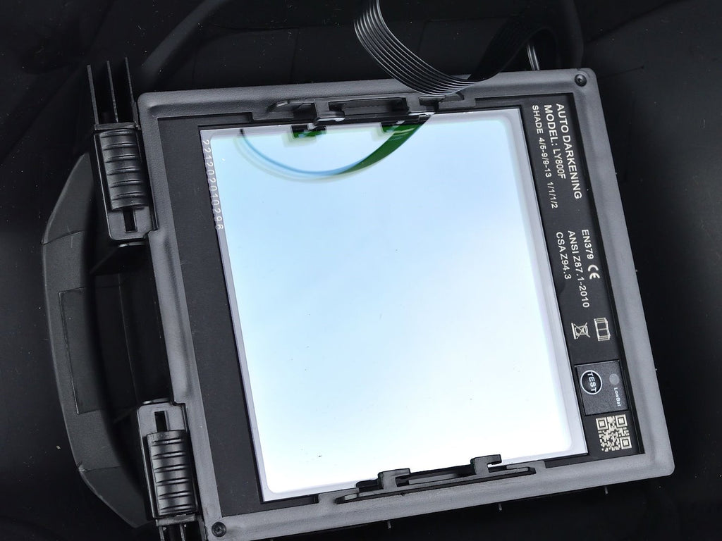 Auto-darkening welding helmet with a large visor